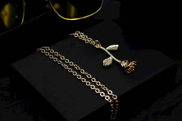 A pair of glasses sitting on top of a black box